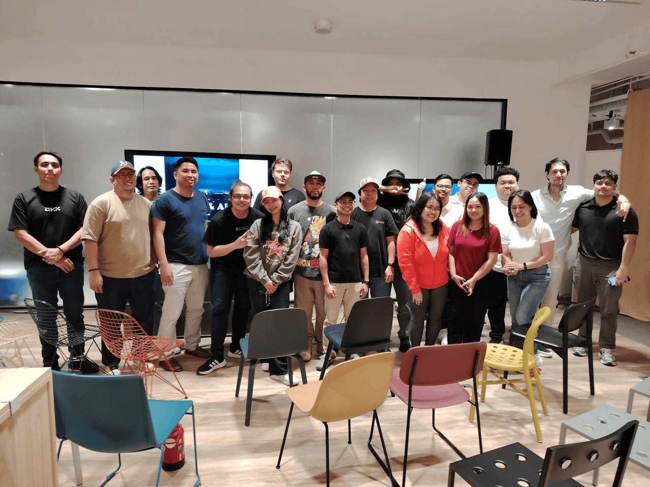 Aya community members gathered for a group photo at an event in Vietnam